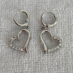 Silver heart-shaped earrings with faux diamonds purchased in Italy